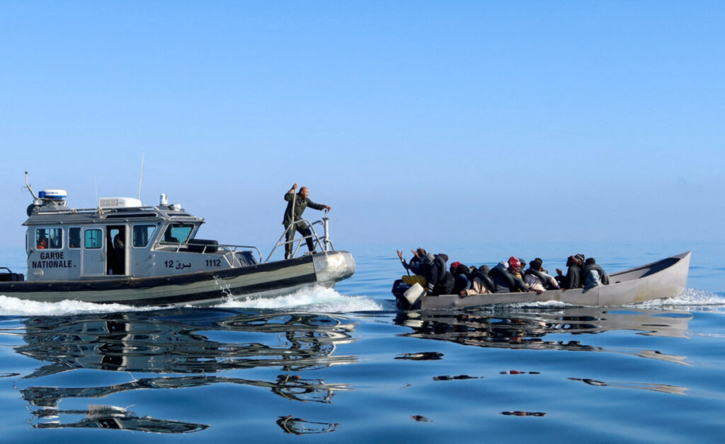 Tunisian coast guards try to stop migrants at sea during their attempt to cross to Italy, off the coast off Sfax, Tunisia, on 27th April, 2023.