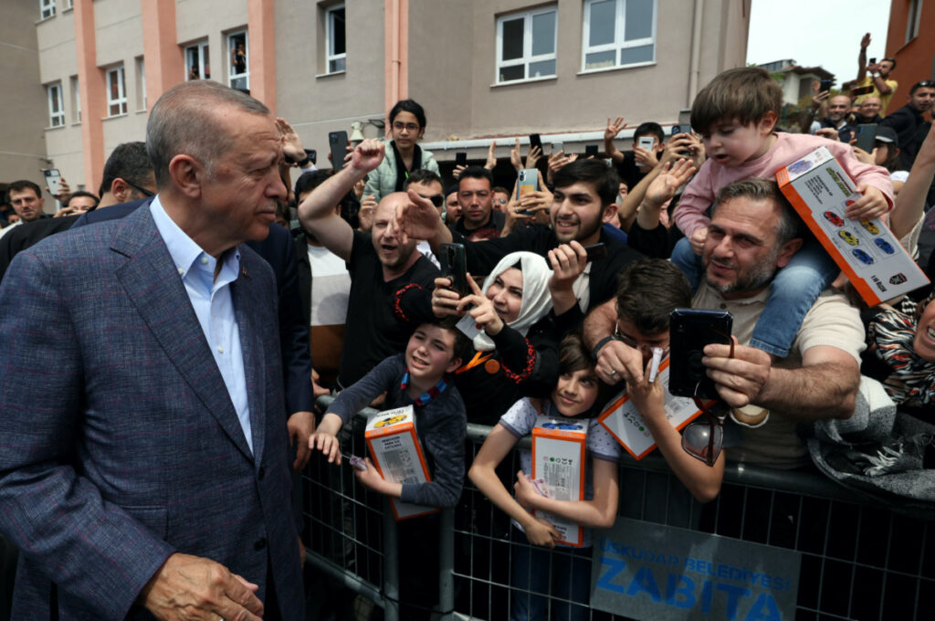 Turkish President Tayyip Erdogan greets his supporters after he casts his ballot at a polling station in Istanbul, Turkey, on 14th May, 2023.