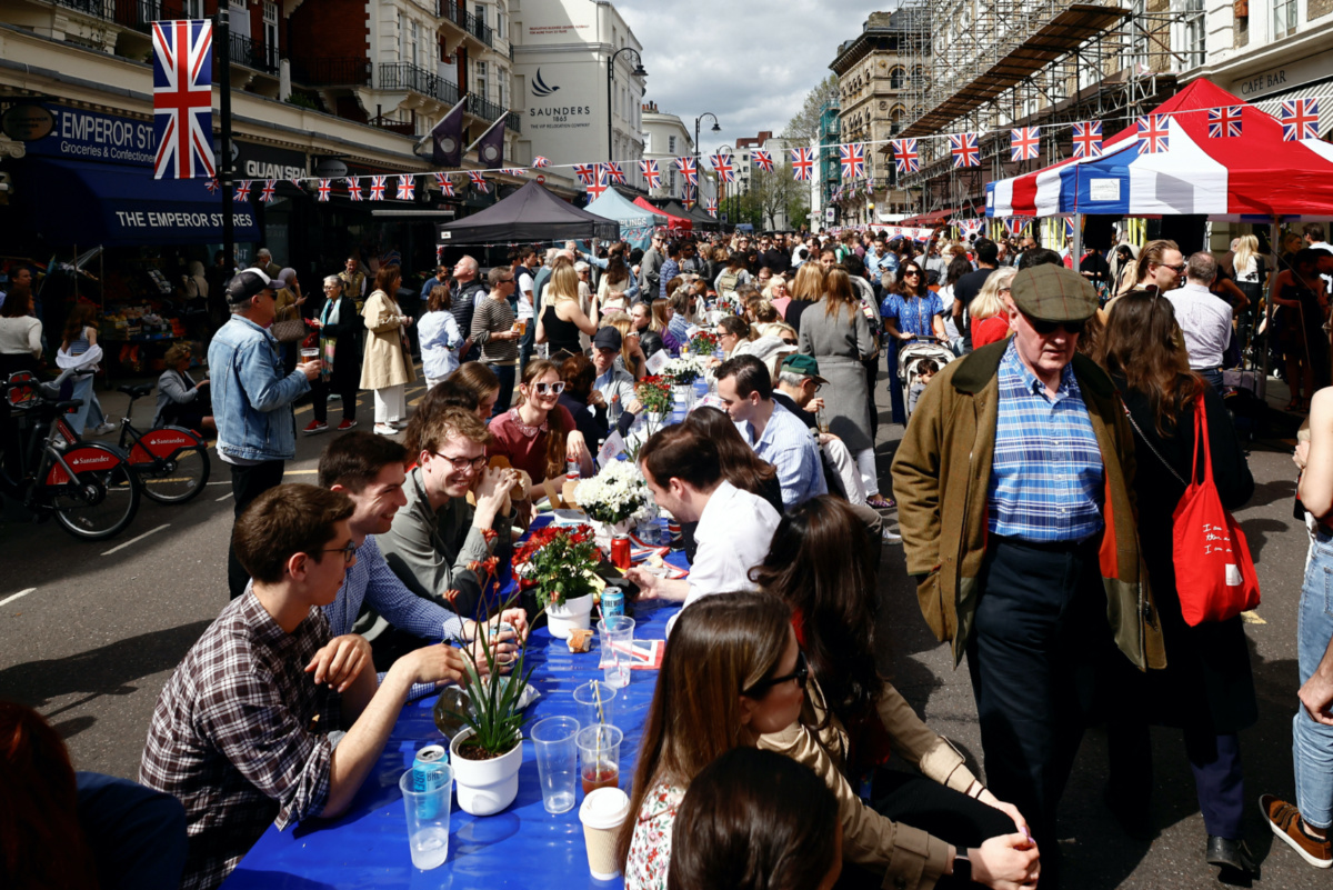 People take part in a Big Lunch event to celebrate the coronation of Britain's King Charles, at Gloucester Street in London, Britain, on 7th May, 2023. 