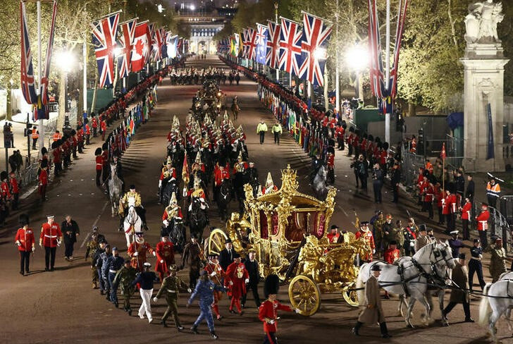The Gold State Coach is ridden alongside members of the military during a full overnight dress rehearsal of the Coronation Ceremony of Britain’s King Charles and Camilla, Queen Consort in London, Britain, on 3rd May, 2023