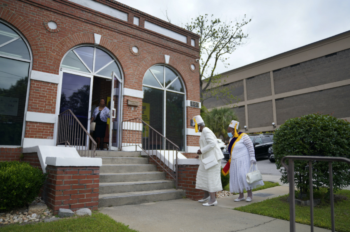 Members of the District 4 Eastern Stars are greeted at the door before attending Sunday service at Zion Baptist Church on 16th April, 2023, in Columbia, South Carolina