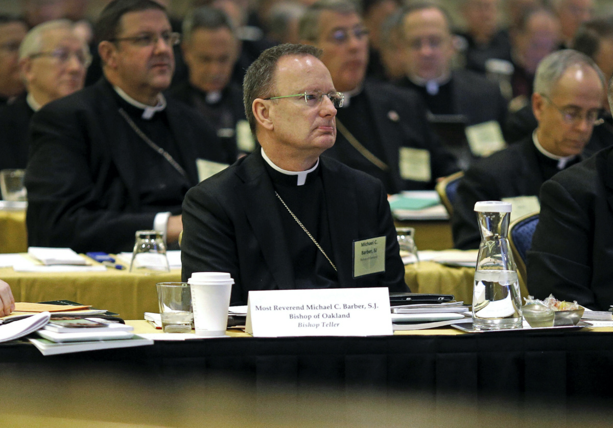 Roman Catholic Diocese of Oakland Bishop Michael Barber, centre, listens to a presentation alongside fellow bishops at the United States Conference of Catholic Bishops' annual fall meeting in Baltimore, on 12th November, 2013.
