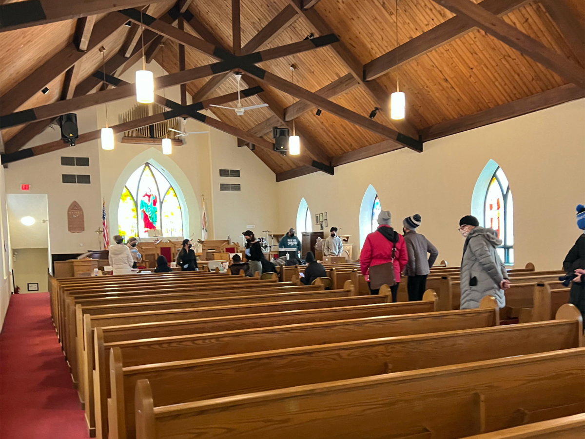 Community members wait in line for vaccinations at Bethel African Methodist Episcopal Church in Ardmore, Pennsylvania, in January 2022.