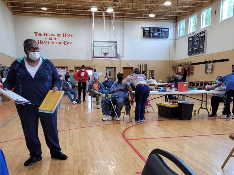Community members receive vaccinations at a location organized by the Partnership of African American Churches in Charleston, West Virginia. 