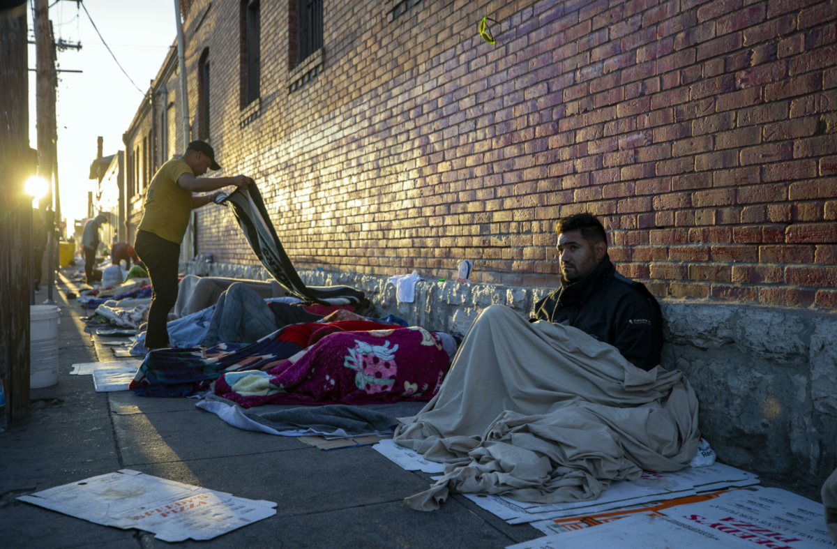 In this photo taken on Tuesday, 9th May, 2023, migrants wake up at the campsite outside Sacred Heart Church in downtown El Paso, Texas. 