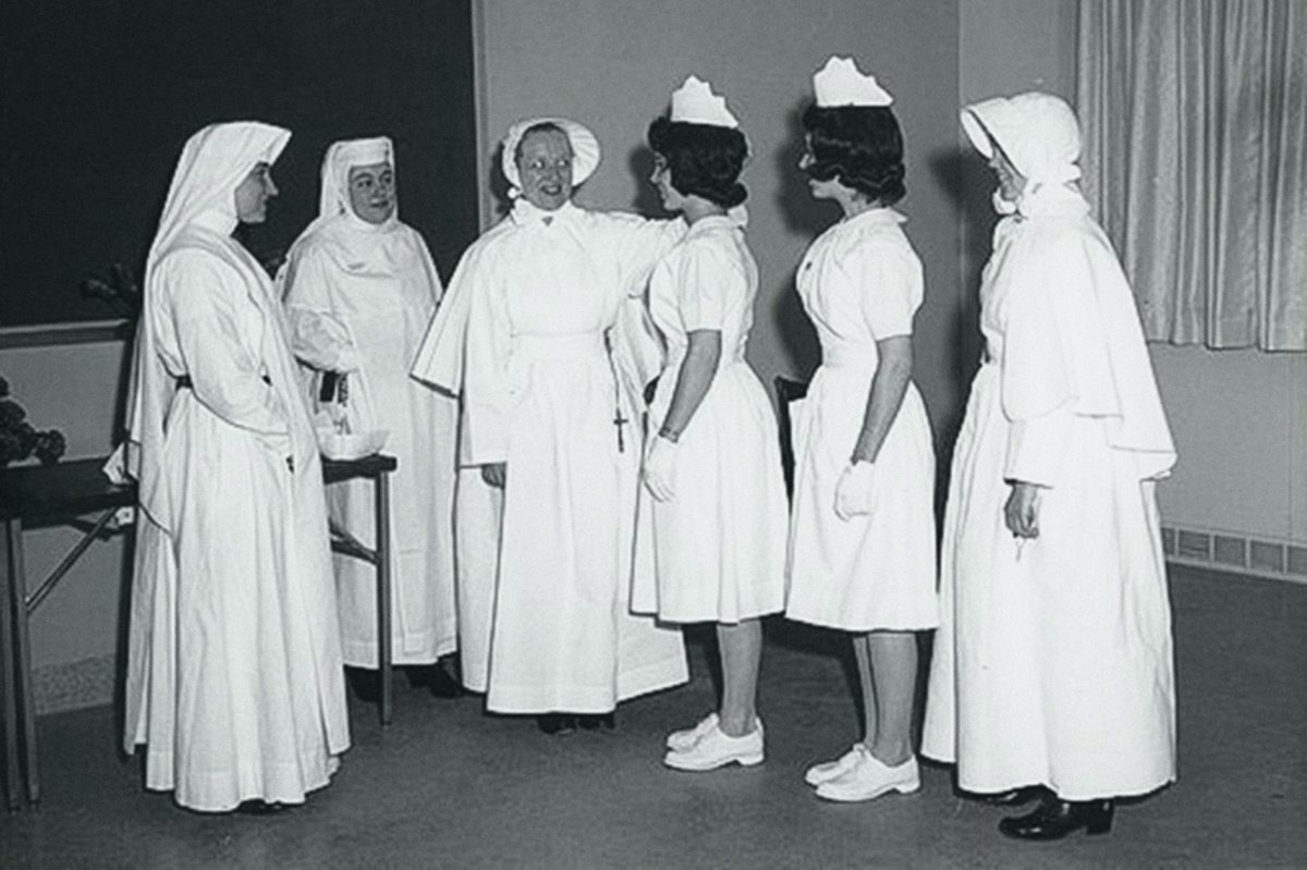 In this photo provided by the Sisters of Charity, new nursing graduates participate in a capping and tea ceremony at St Vincent's School of Nursing on the Staten Island borough of New York, on 4th January, 1963.