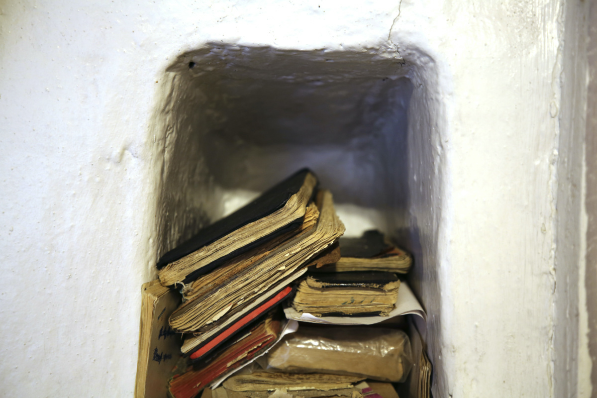Handbooks of prayers and hymns, known as 'cuadernos', sit in a niche in the adobe wall of the morada de San Isidro, outside Holman, New Mexico, on Saturday, 15th April, 2023.