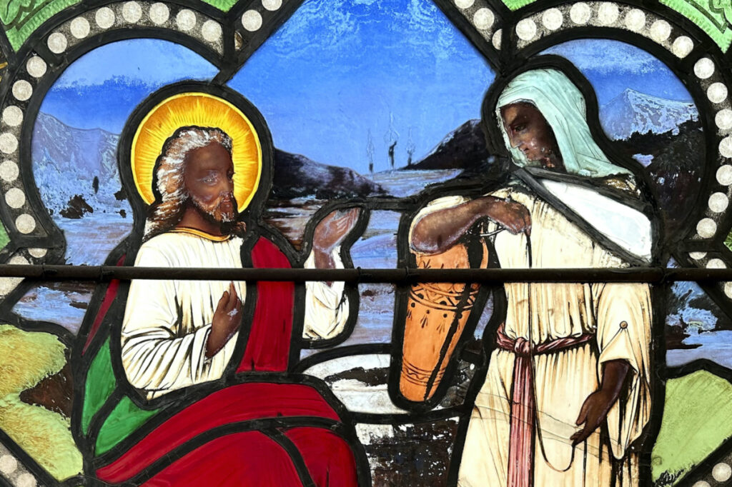 A detail of a nearly 150-year-old stained-glass window depicts Christ speaking to a Samaritan woman, in the now-closed St Mark's Episcopal church, on Monday, 1st May, 2023, in Warren, Rhode Island