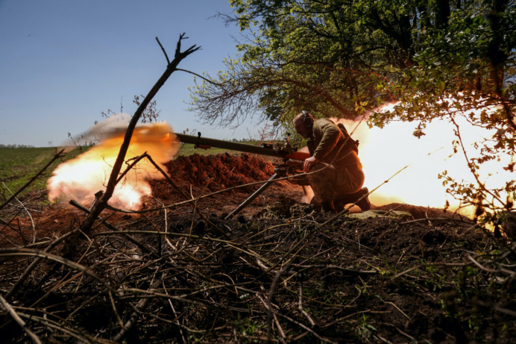 A Ukrainian service member from a 28th separate mechanised brigade named after the Knights of the Winter Campaign of the Armed Forces of Ukraine, fires an anti-tank grenade launcher at a front line, amid Russia's attack on Ukraine, near the city of Bakhmut, Ukraine, on 3rd May, 2023.
