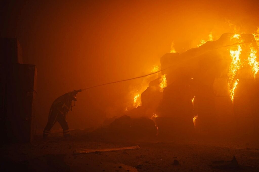 A firefighter works at a site of a tobacco factory damaged during Russian drone strike, amid Russia's attack on Ukraine, in Kyiv, Ukraine, on 28th May, 2023
