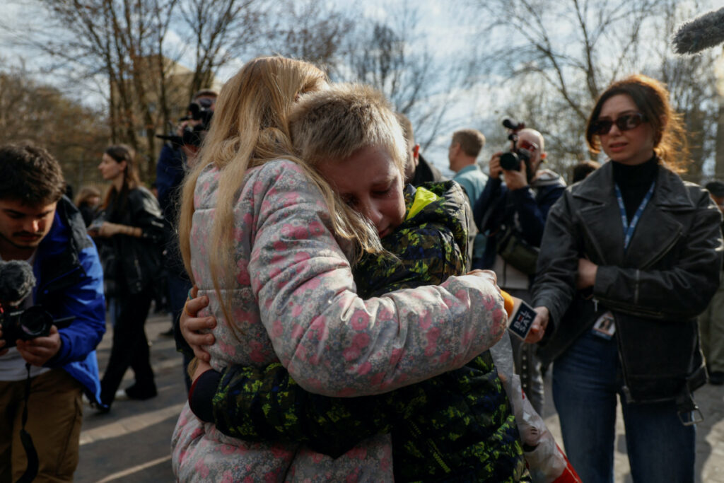 Iryna embraces her 13-year-old son Bohdan, who went to a Russian-organised summer camp from non-government controlled territories and was then taken to Russia, after he returned via the Ukraine-Belarus border, in Kyiv, Ukraine on 8th April, 2023.