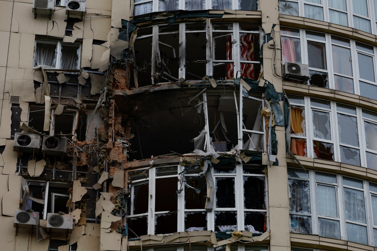 A view shows an apartment building damaged by remains of a suicide drone, which local authorities consider to be Iranian made unmanned aerial vehicles Shahed-131/136, shot down during a Russian overnight strike, amid Russia's attack on Ukraine, in Kyiv, Ukraine on 8th May, 2023