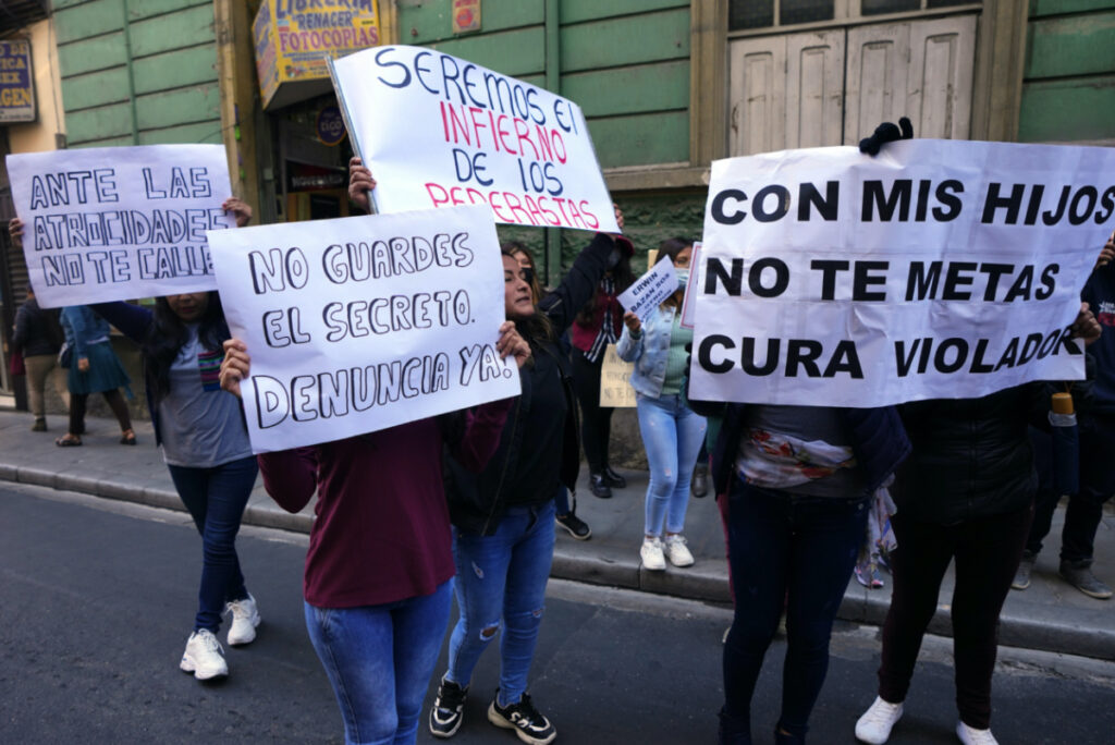 People protest with signs against sexual abuse by a priest outside the Bolivian Archbishopric office in La Paz, Bolivia, Friday, on 19th May, 2023