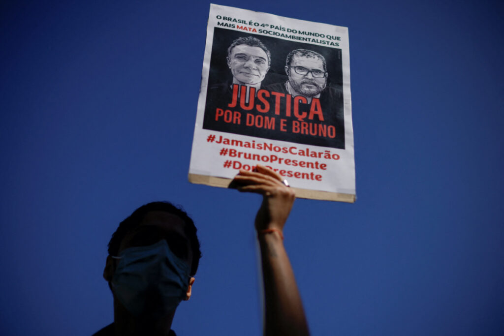 A demonstrator holds a sign during a protest, to demand justice for journalist Dom Phillips and indigenous expert Bruno Pereira, who were murdered in the Amazon, in Brasilia, Brazil, on 19th June, 2022.