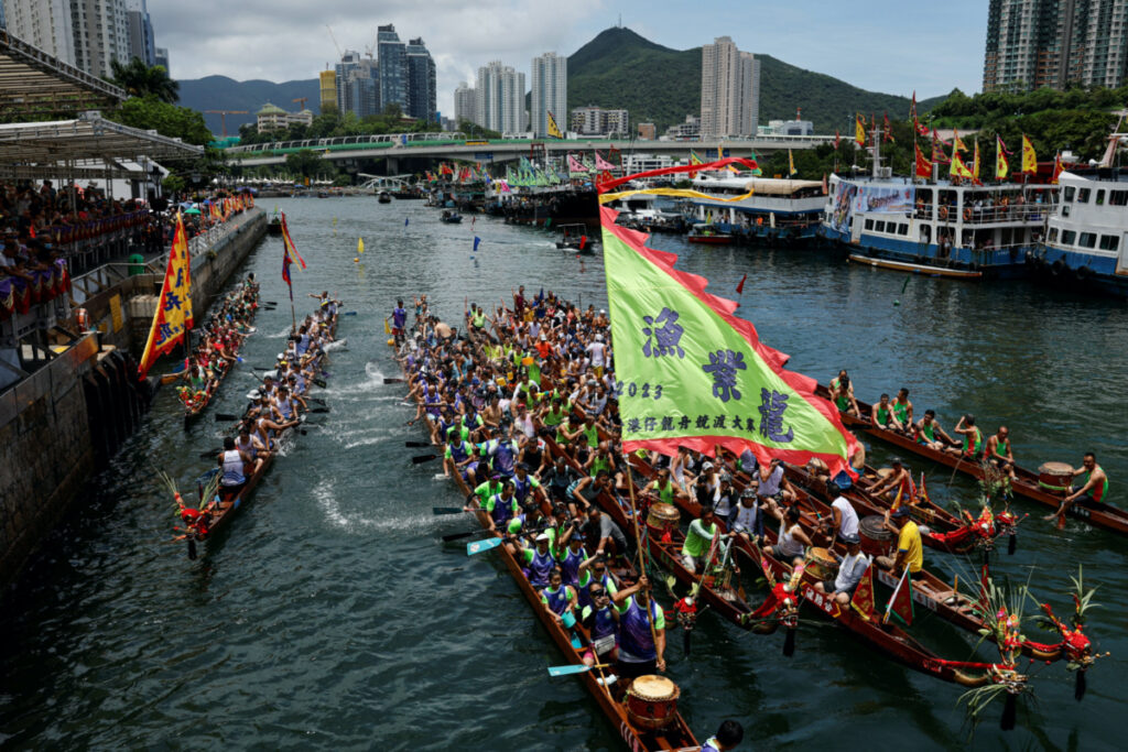 Dragon boats get together during a ceremony as part of the celebration to mark the annual Tuen Ng or Dragon Boat Festival at Aberdeen fishing port in Hong Kong, China, on 22nd June, 2023.