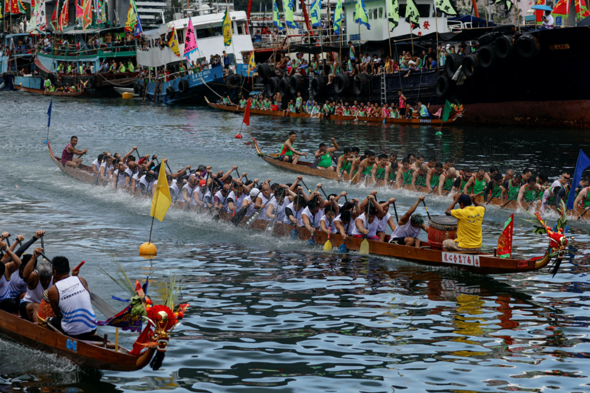 Dragon boats compete during the annual Tuen Ng or Dragon Boat Festival at Aberdeen fishing port in Hong Kong, China, on 22nd June, 2023