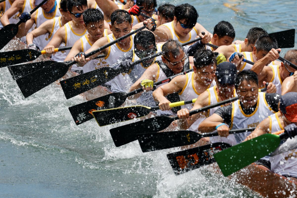 Participants compete in a dragon boat during the annual Tuen Ng or Dragon Boat Festival at Aberdeen fishing port in Hong Kong, China, on 22nd June, 2023.