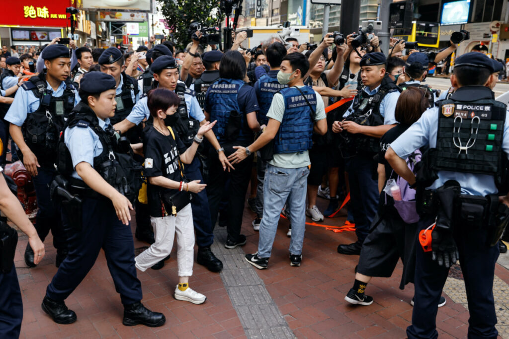Police detain a person in downtown on the 34th anniversary of the 1989 Beijing's Tiananmen Square crackdown, near where the candlelight vigil is usually held, in Hong Kong, China, on 4th June, 2023.