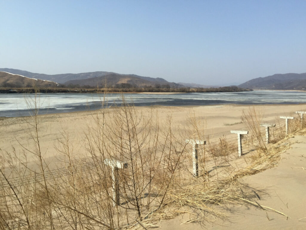 A barbed-wire fence separating North Korea from China is seen in this photo taken from the Chinese border city of Hunchun, China, on 18th March, 2015.