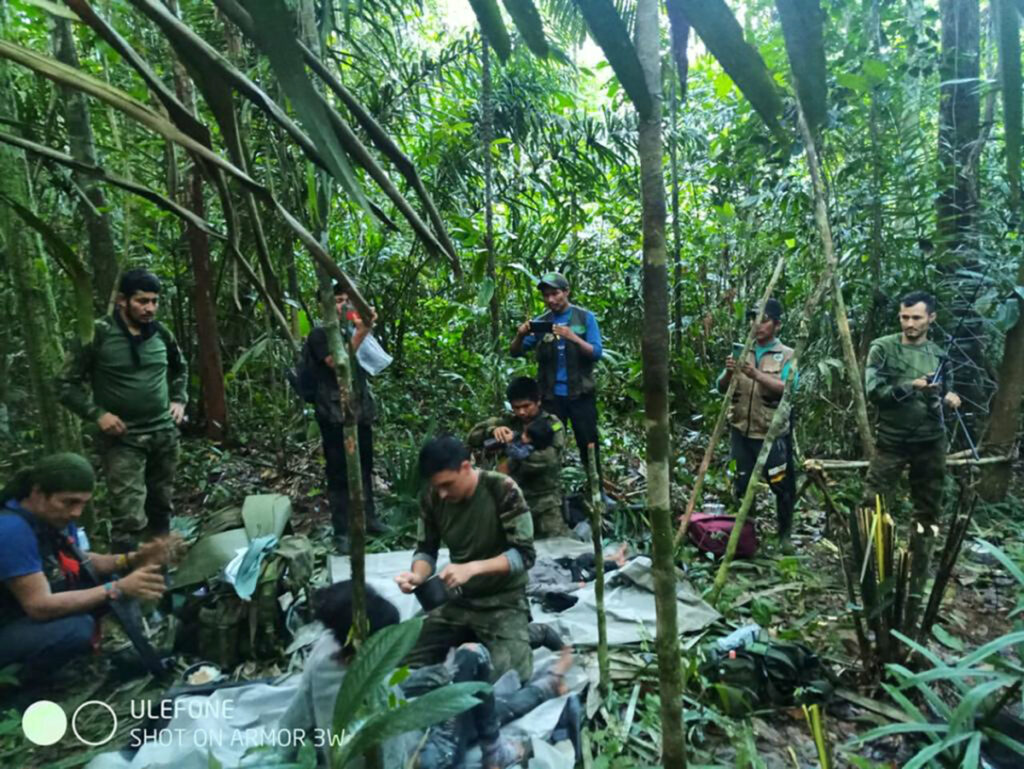 Colombian military soldiers attend to child survivors from a Cessna 206 plane that crashed on 1st May in the jungles of Caqueta, in limits between Caqueta and Guaviare, in this handout photo released on 9th June, 2023.