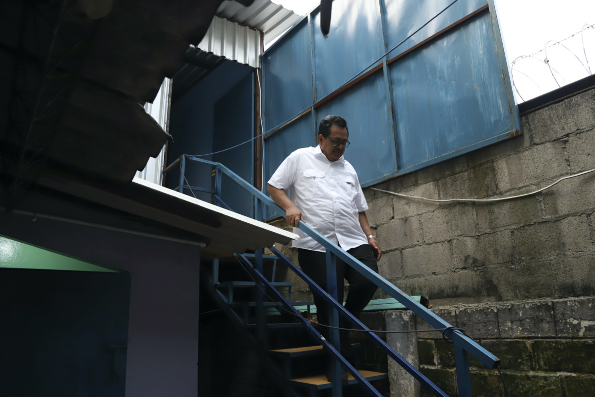 Rev, Nelson Moz descends a flight of stairs from an empty room where former gang members were housed, behind the Eben-Ezer Church, in San Salvador, El Salvador, on Saturday, 29th April, 2023. 