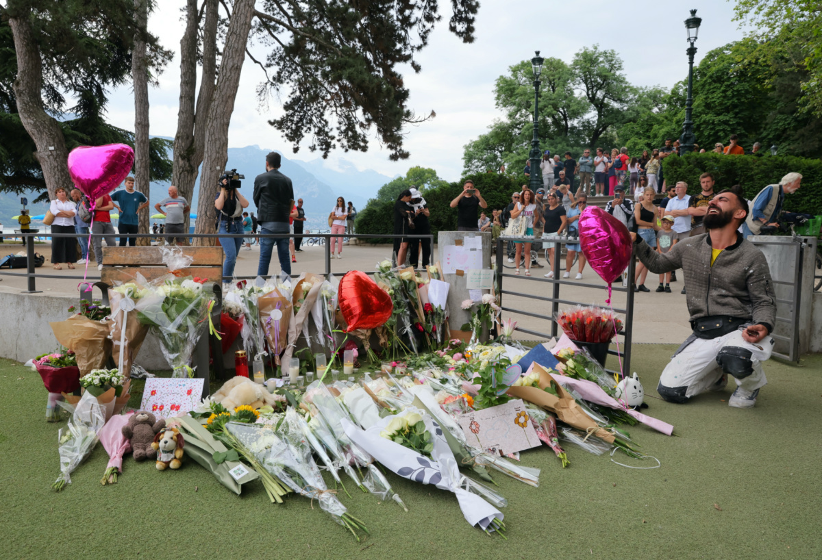 Salih Ismajl reacts as he pays respect in front of messages and floral tributes at the children's playground the day after several children and adults were injured in a knife attack at the Le Paquier park near the lake in Annecy, in the French Alps, France, on 9th June, 2023. 