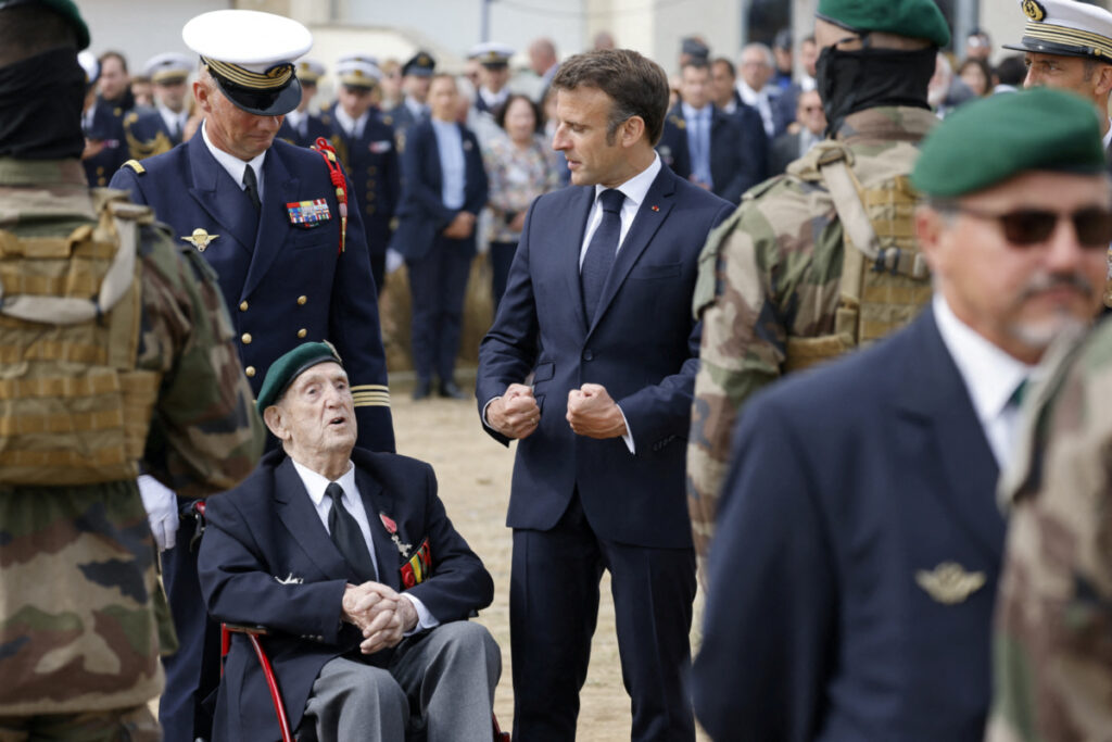 French President Emmanuel Macron and French WWII veteran of the Commando Kieffer Leon Gautier attend a ceremony in tribute to the 177 French members of the "Commando Kieffer" Fusiliers Marins commando unit who took part in the Normandy landings, as part of the 79th anniversary of the World War II "D-Day" Normandy landings, in Colleville-Montgomery, France, on 6th June, 2023.