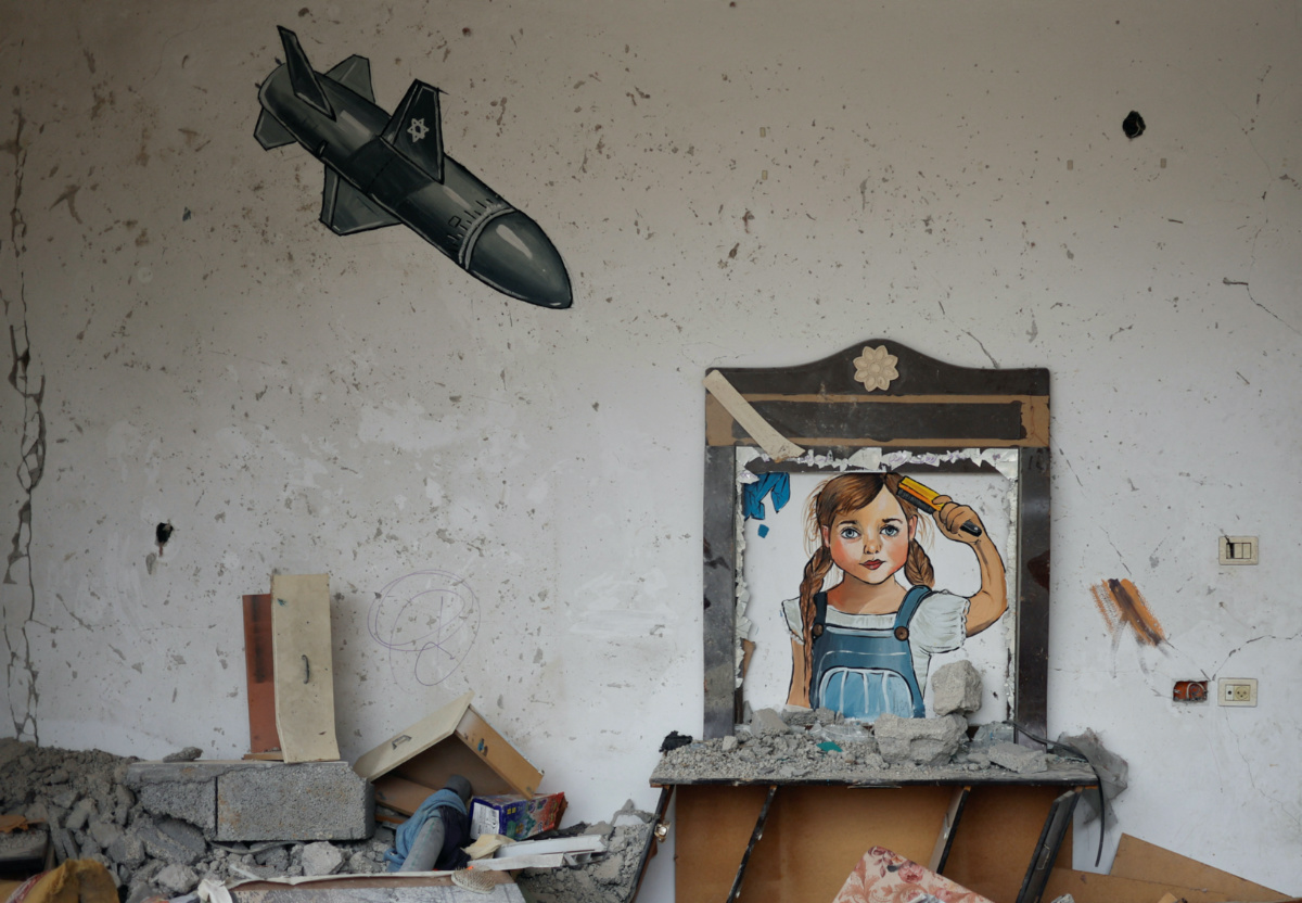 A painting drawn by artists is seen at a house destroyed by Israel, in recent Israeli-Gaza fighting, in Deir Al-Balah, central Gaza Strip, on 13th June, 2023.  REUTERS/Mohammed Salem
