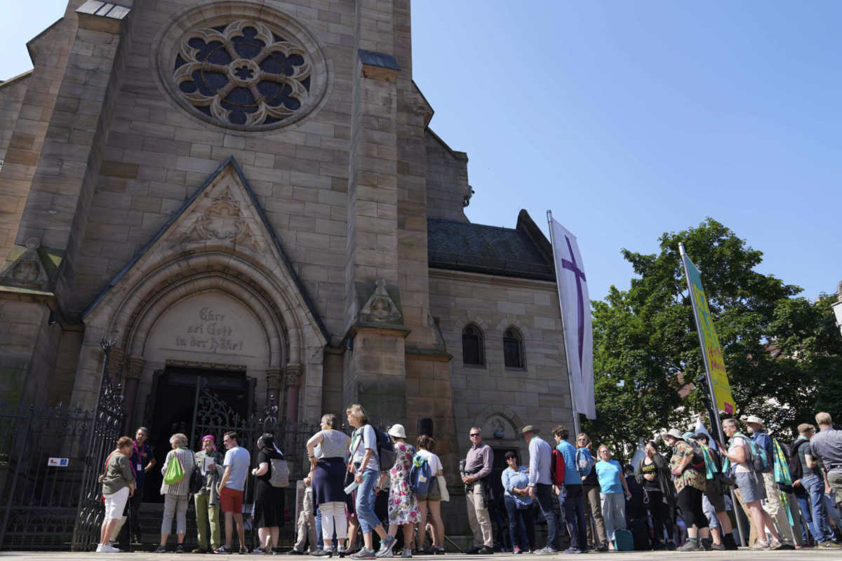 People queue for a church service in Nuremberg, Germany, Friday, on 9th June, 2023. 