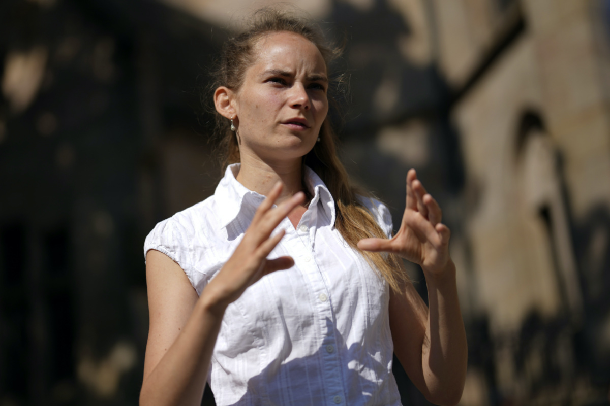 Anna Puzio, 28, researcher for ethics of technology at University of Twente, Netherlands, gestures during an interview with The Associated Press in Nuremberg, Germany, on Friday, 9th June, 2023. 