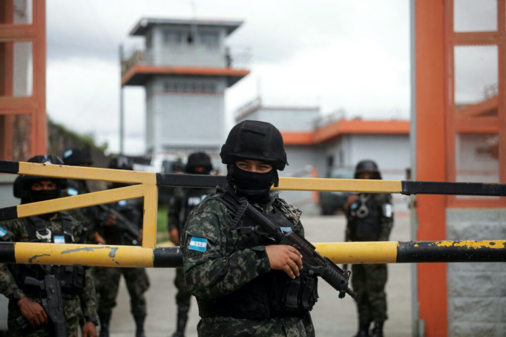 Members of the Military Police of Public Order keep watch at one of the entrances to Tamara prison, after the Honduras Armed Forces took over the control of the prisons nationwide as part of the "Fe y Esperanza" operation, on the outskirts of Tegucigalpa, Honduras, on 26th June, 2023.