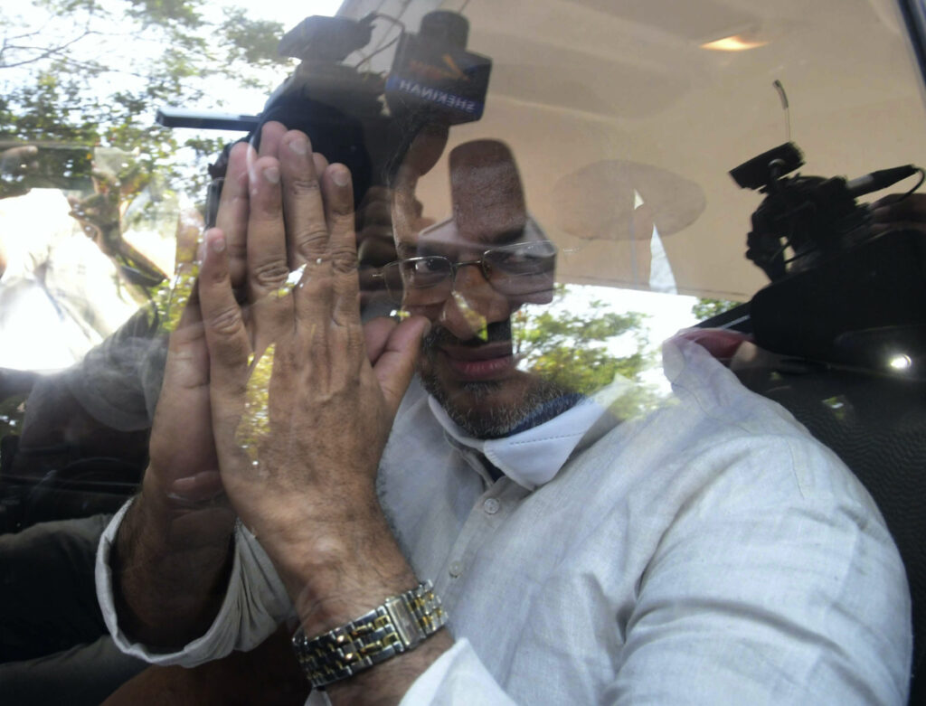 Bishop Franco Mulakkal greets the media as he leaves a court in Kottayam, India, on Friday, 14th January, 2022.