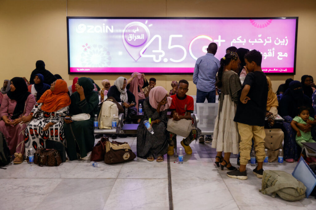 People, who were evacuated from Sudan by an Iraqi military aircraft, are seen at Baghdad International Airport in Baghdad, Iraq, on 18th June, 2023.