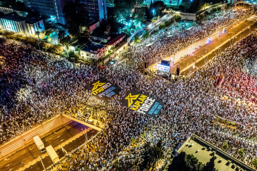An aerial view shows protesters holding banners as they demonstrate against Israeli Prime Minister Benjamin Netanyahu and his nationalist coalition government's judicial overhaul, in Tel Aviv, Israel on 24th June, 2023