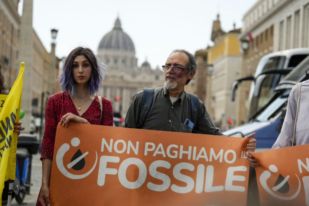 Ultima Generazione activists Ester Goffi, left, and Guido Viero demonstrate at The Vatican,on Wednesday, 24th May, 2023