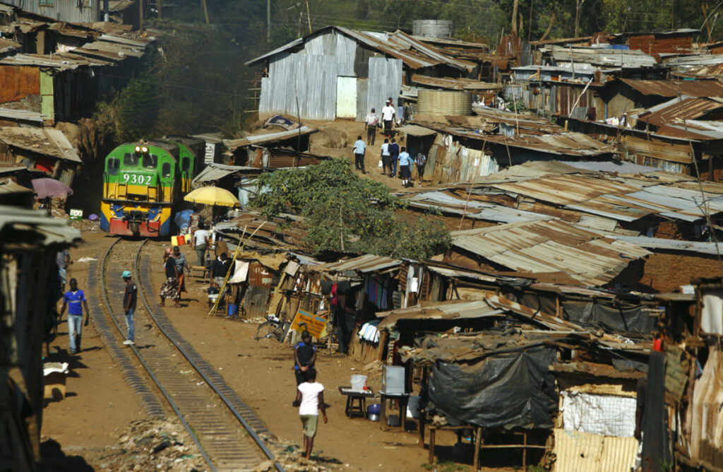 A train passes through the Kibera slum of Kenya's capital Nairobi on 26th February, 2015.