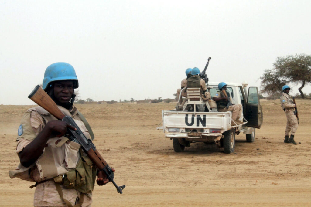 UN peacekeepers stand guard in the northern town of Kouroume, Mali, on 13th May, 2015.