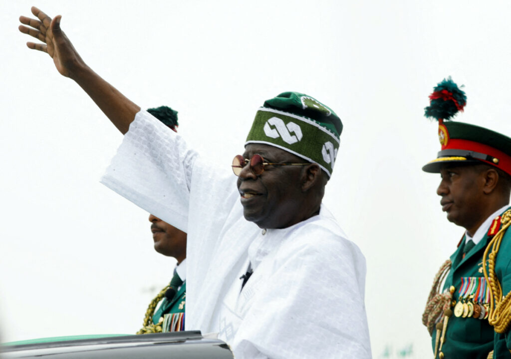 Nigeria's President Bola Tinubu waves to a crowd as he takes the traditional ride on top of a ceremonial vehicle, after his swearing-in ceremony in Abuja, Nigeria, on 29th May, 2023.