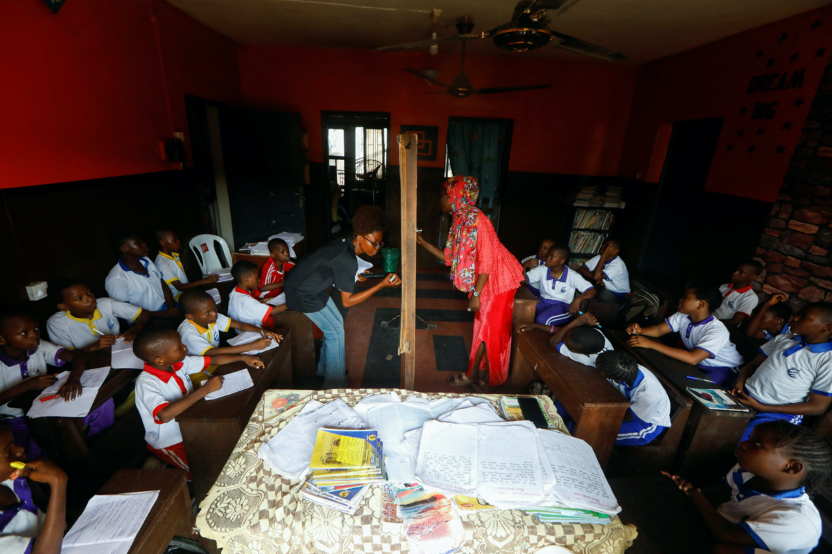 Students attend classes at My Dream Stead, a low-cost school that accepts recyclable waste as payment, in Ajegunle, Lagos, Nigeria, on 19th May, 2023. 