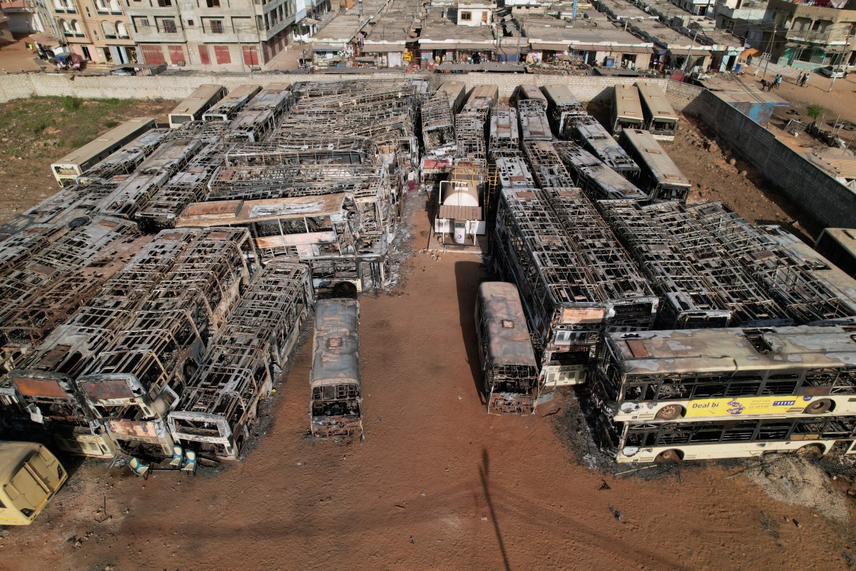 Burnt-out buses which belong to a partly state-funded "Dem Dikk" company, that provides intercity, national and regional bus services, are seen following violent protests after Senegal opposition leader Ousmane Sonko was sentenced to prison, in Keur Massar neighborhood, Dakar, Senegal, on 7th June, 2023