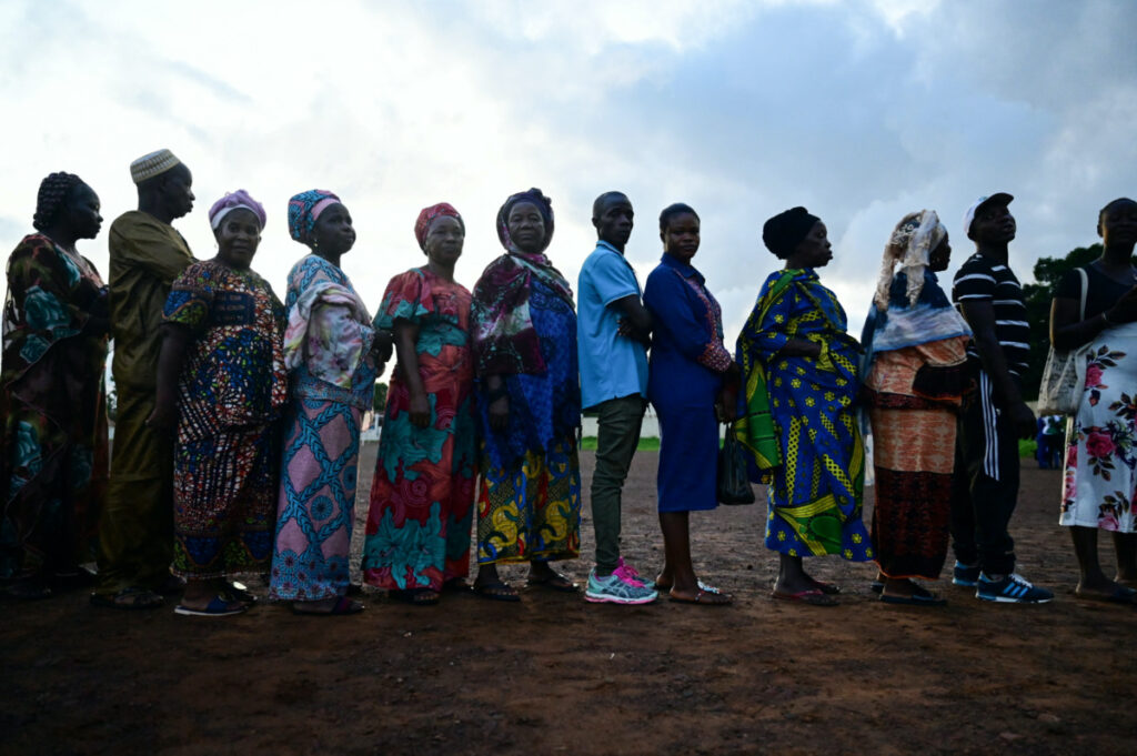 People wait to cast their votes for the national election at a polling station in Freetown, Sierra Leone, on 24th June, 2023.