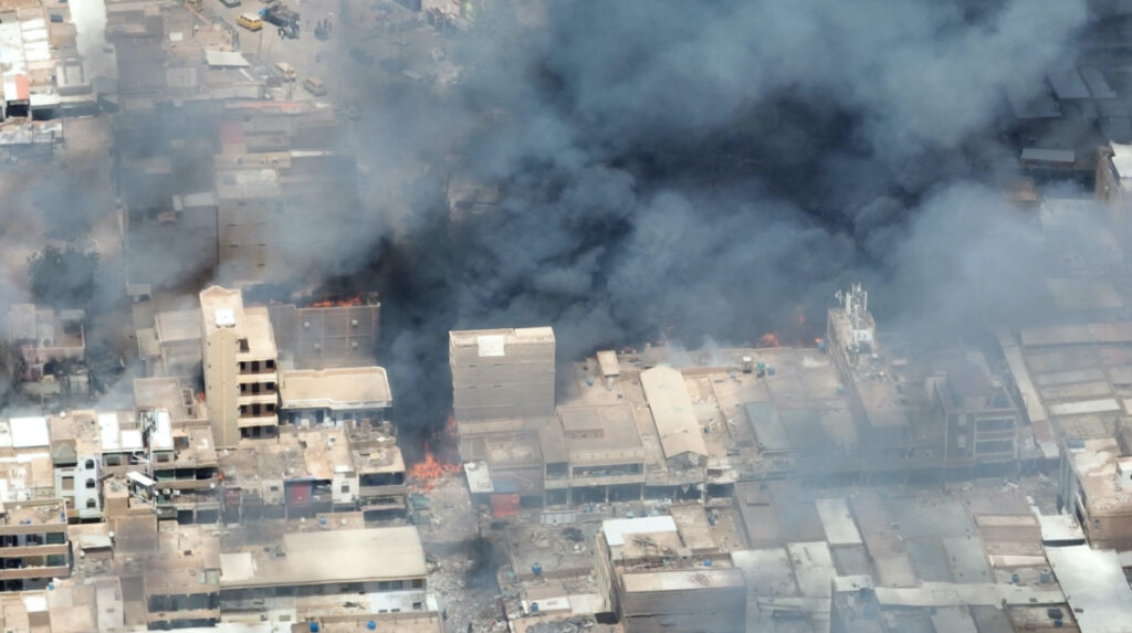 A view shows black smoke and fire at Omdurman market in Omdurman, Sudan, on 17th May, 2023, in this screengrab from a video obtained by Reuters.