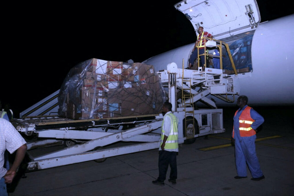 People unload boxes containing medical aid off a plane from Kenya, following the crisis in Sudan's capital Khartoum, at the military airport in Port Sudan, Sudan, on 30th May, 2023.