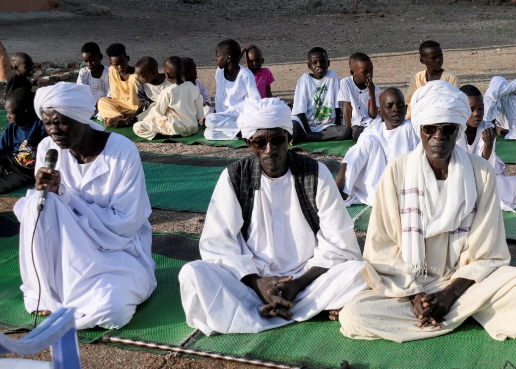 Sudanese men attend Eid al-Adha prayer following the crisis in Sudan's capital Khartoum, in the Sudanese state of al-Qadarif, Sudan, on 28th June, 2023.