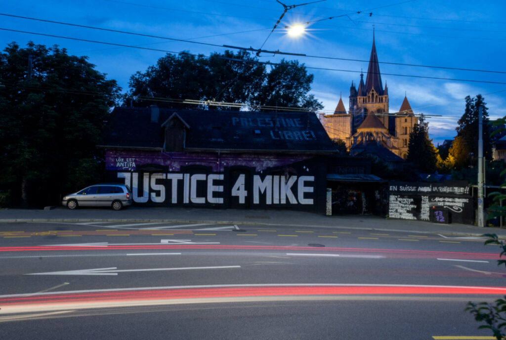 A graffiti calling for justice for Mike Ben Peter is seen in front of the Cathedral, the day before the start of the trial of the six police officers facing homicide charges after he died of a heart attack during his arrest in February 2018, in Lausanne, Switzerland, on 11th June, 2023.