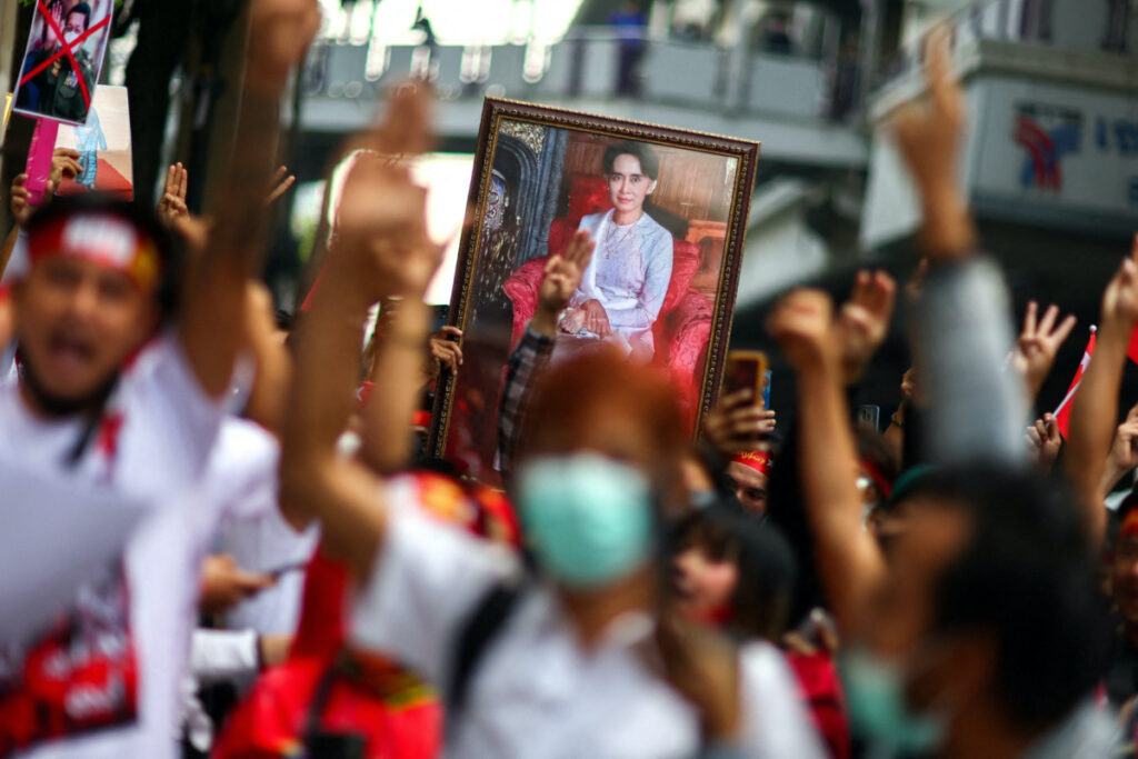 Protesters hold up a portrait of Aung San Suu Kyi and raise three-finger salutes, during a demonstration to mark the second anniversary of Myanmar's 2021 military coup, outside the Embassy of Myanmar in Bangkok, Thailand, on 1st February, 2023.