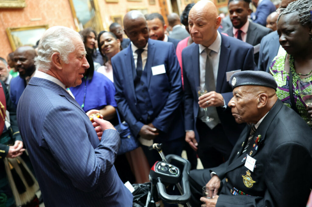 Britain's King Charles III speaks with a guest during a reception to mark the 75th anniversary of the arrival of HMT Empire Windrush, at Buckingham Palace, London, Britain, on 14th June, 2023.