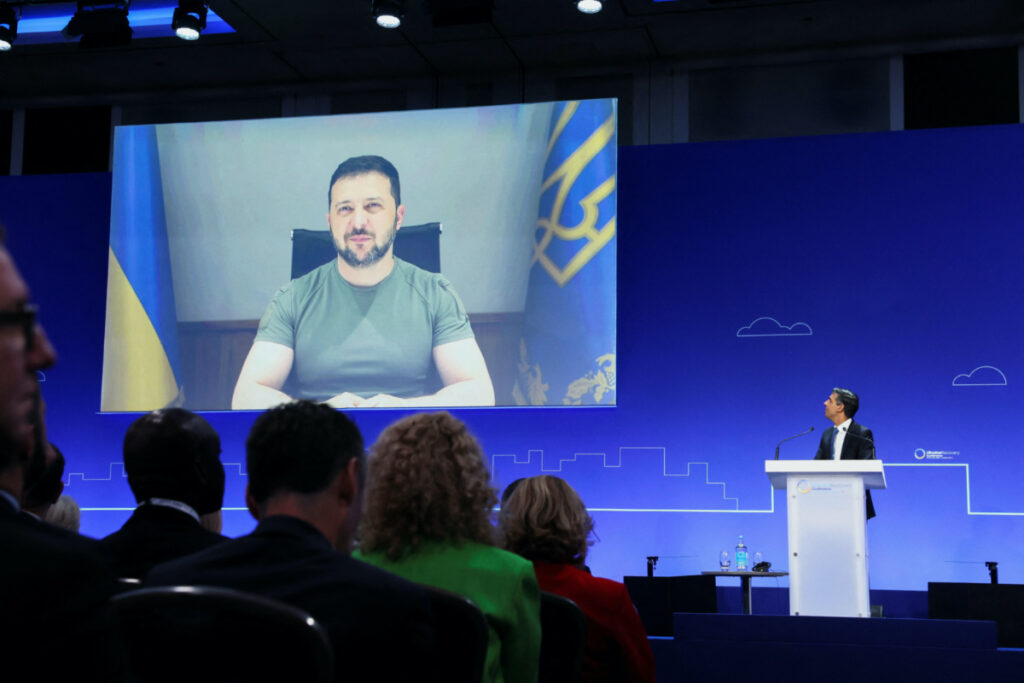 Ukraine's President Volodymyr Zelenskiy attends through video link as British Prime Minister Rishi Sunak looks on during the Ukraine Recovery Conference at the Intercontinental O2 Hotel in London, Britain, on 21st June, 2023.