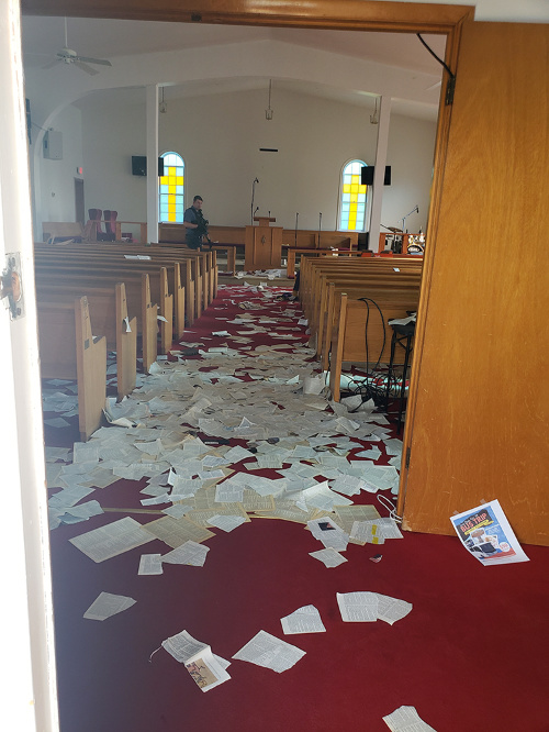 A police officer investigates vandalism at Fowler United Methodist Church in Annapolis, Maryland, on 9th June, 2023.