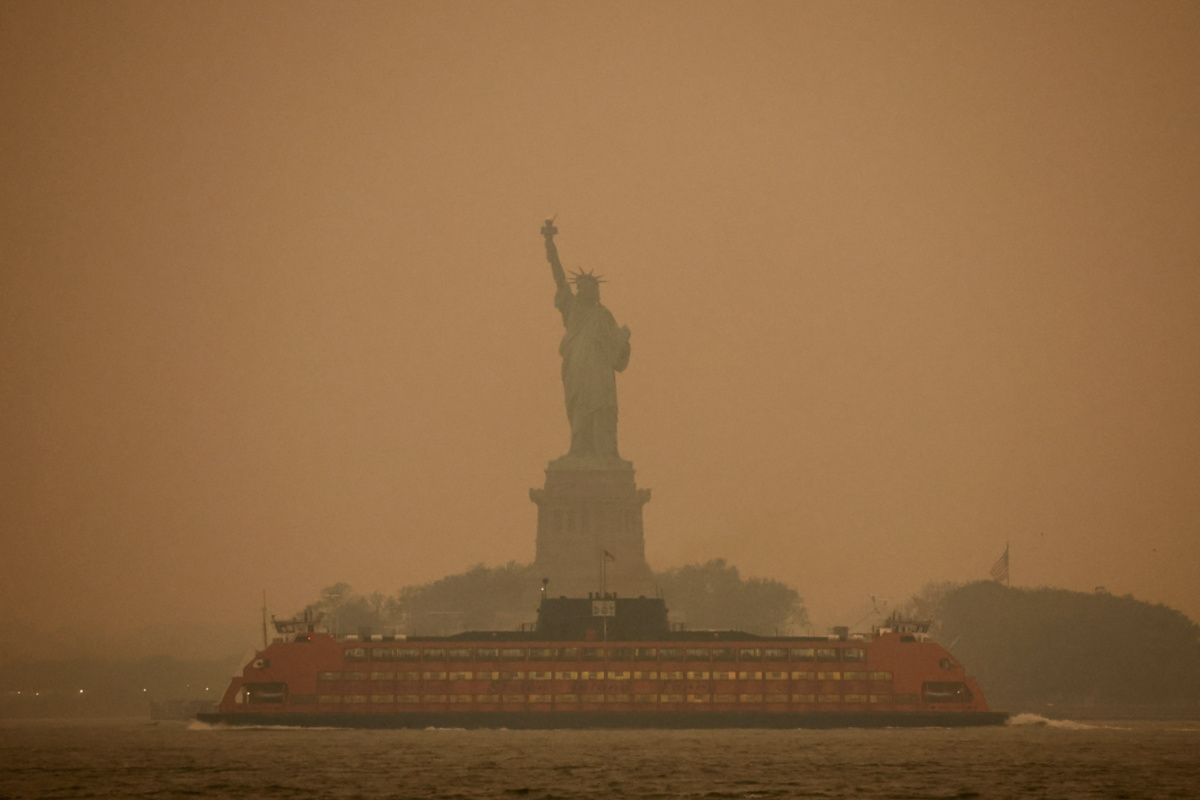 The Statue of Liberty is covered in haze and smoke caused by wildfires in Canada, in New York City, on 6th June, 2023
